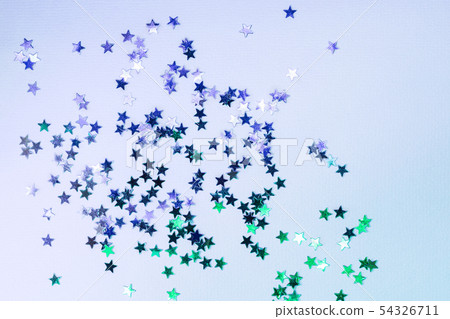 Holographic confetti stars on blue neon background 54326711