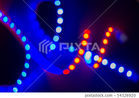 Red and blue blurry neon spirals of bokeh lights 54326920