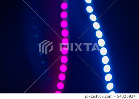 Pink and blue blurry neon bokeh lights on black. Pink and blue blurry neon bokeh lights on black. 54326924