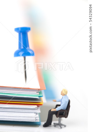 Miniature Businessman and Papers File Miniature Businessman and Papers File 54329094