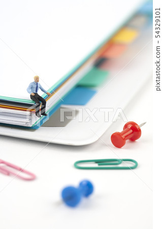 Miniature Businessman and Papers File Miniature Businessman and Papers File 54329101