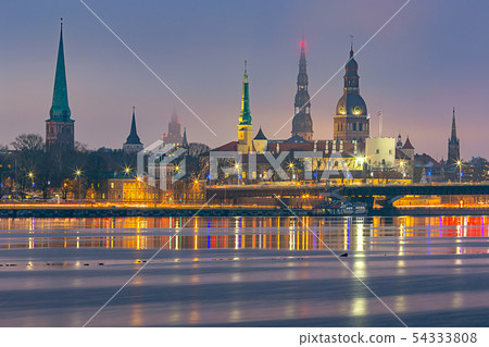 Riga. View of the city embankment and the old city at sunset. Riga. View of the city embankment and the old city at sunset. 54333808