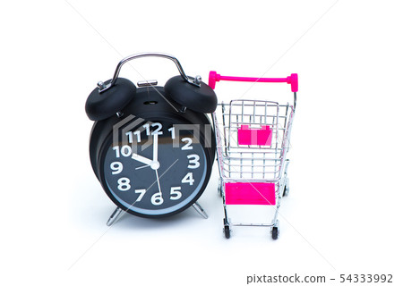 Black alarm clock and shopping cart or supermarket 54333992