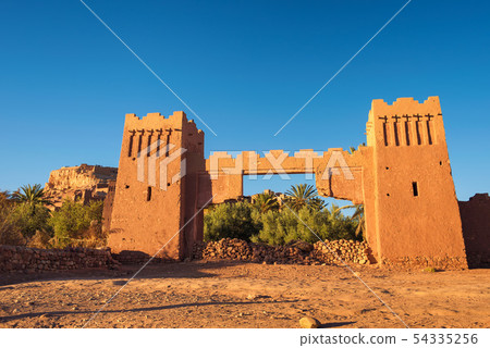 Entry gate of Ait Benhaddou in Morocco at sunset 54335256