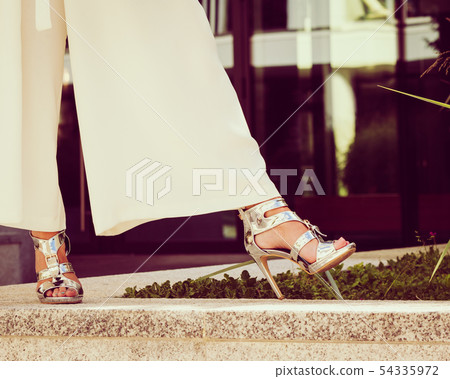Woman wearing high heels and culottes 54335972