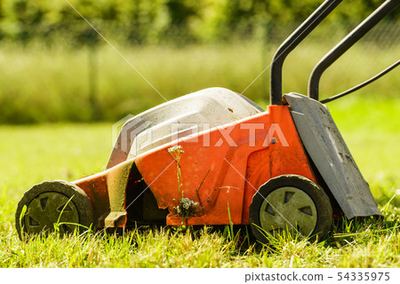 Gardening. Mowing lawn with lawnmower Gardening. Mowing lawn with lawnmower 54335975