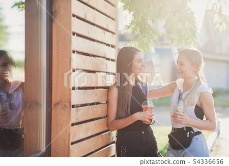 two happy young women two happy young women 54336656