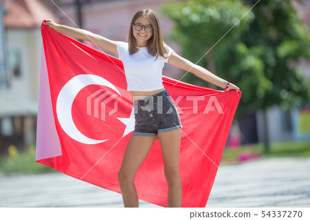 Happy girl tourist walking in the street with 54337270