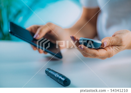 Blood Sugar Testing with Portable Glucometer 54341210