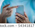 Woman Using Smart Phone App, Measuring Heart Rate 54341817