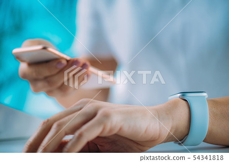Woman Measuring Heart Rate, Using Smart Phone and Woman Measuring Heart Rate, Using Smart Phone and 54341818