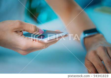 Woman Measuring Heart Rate, Using Smart Phone and Woman Measuring Heart Rate, Using Smart Phone and 54341819