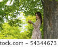Young woman reading Korean 54344673