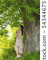 Young woman reading Korean 54344675