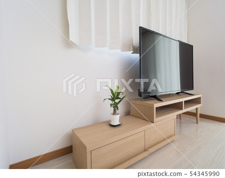 A room with a large TV 54345990