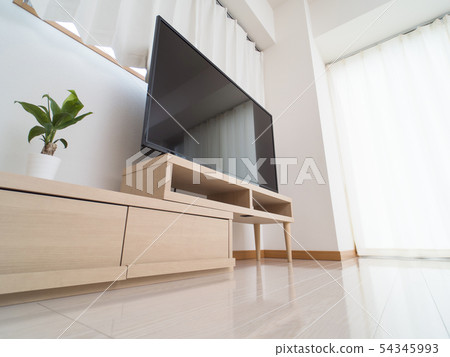 A room with a large TV 54345993