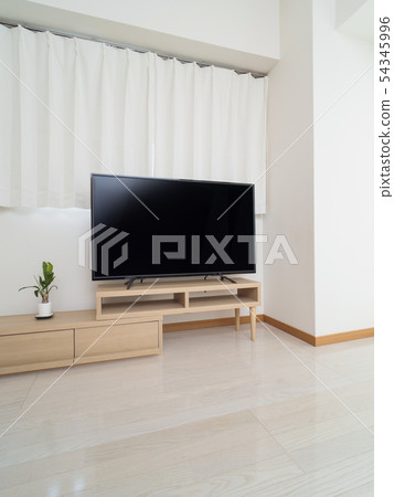 A room with a large TV 54345996