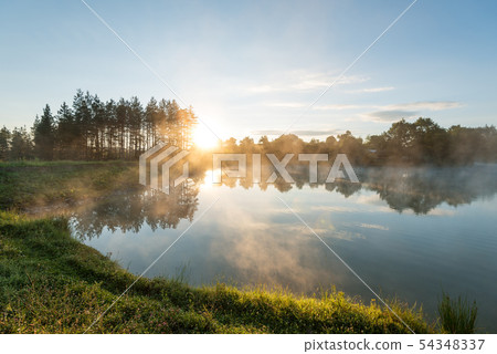 Morning fog on the forest lake. Morning fog on the forest lake. 54348337