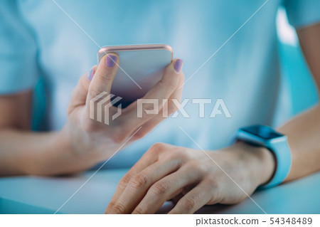 Woman Measuring Heart Rate, Using Smart Phone and Woman Measuring Heart Rate, Using Smart Phone and 54348489