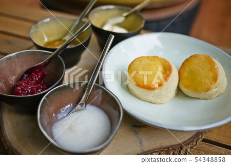 A tasty and delicious set of freshly baked scones 54348858