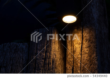 Dim light bulb on the background of a wooden log - Stock Photo [54349440] -  PIXTA