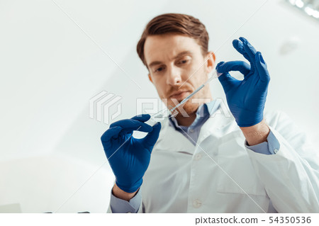 Low angle of a glass piece with test sample Low angle of a glass piece with test sample 54350536