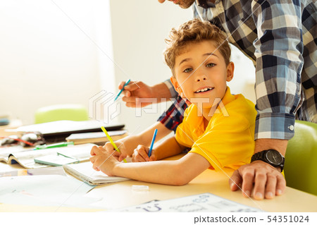 Happy positive boy enjoying his interesting lesson 54351024