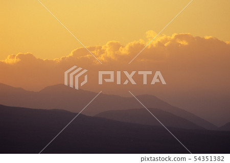 Mountains and evening clouds 54351382