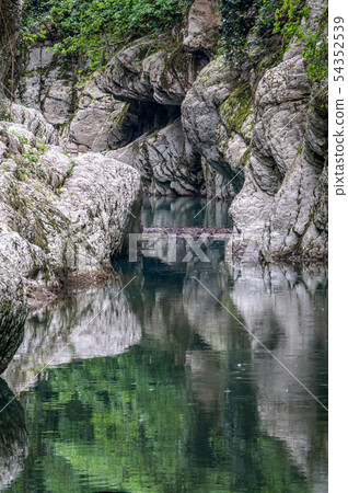Mountain river in a stone gorge 54352539