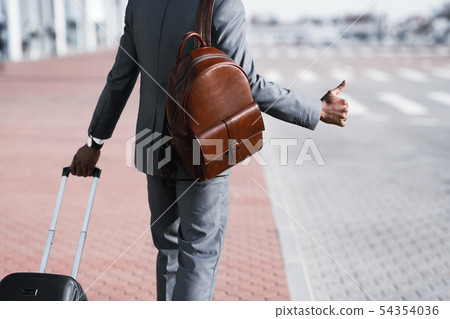Business Executive Calling Cab At the Airport Business Executive Calling Cab At the Airport 54354036