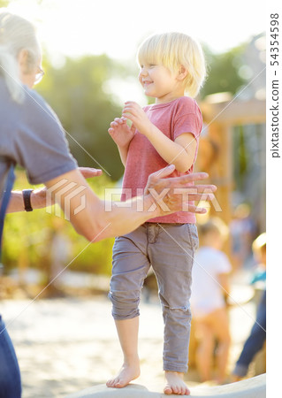 Little boy having fun with his grandfather on 54354598