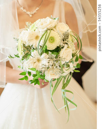 A bride with a bouquet A bride with a bouquet 54355256