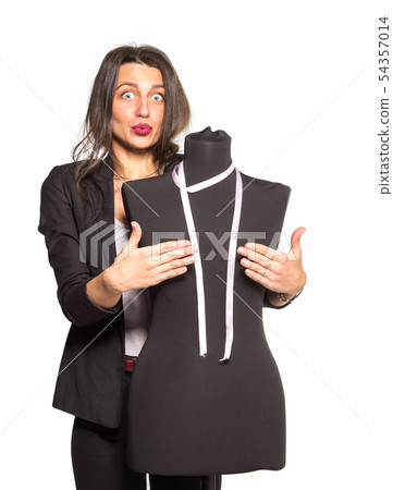 Young tailor posing with mannequin 54357014