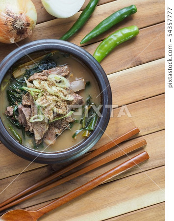 Korean food goat soup with rice and vegetables 54357777