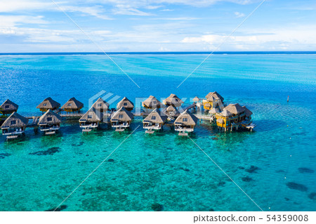 Travel vacation paradise aerial image with overwater bungalows in coral reef sea 54359008