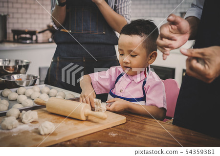 happy family in kitchen 54359381