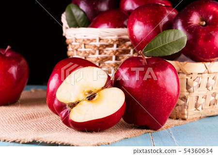 Red apples with leaves on the table 54360634