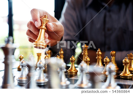 Business man take a king figure checkmate on the 54360864