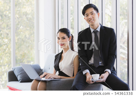 Asian business people posing in office.. Asian business people posing in office.. 54361338