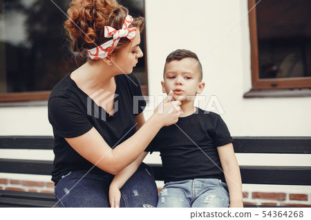 Mother with son playing in a summer city 54364268