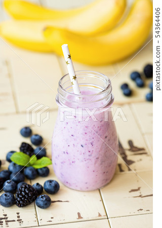 Purple berry and banana smoothie, healthy diet food 54364406