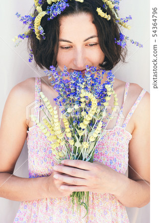 Woman and flowers. 54364796