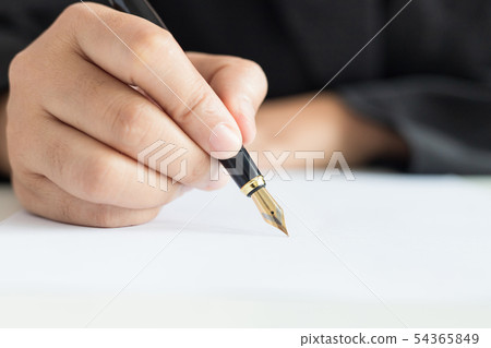 Close up shot hand of business woman using the pen Close up shot hand of business woman using the pen 54365849