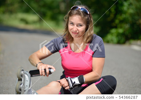 young woman fell on skates 54366287