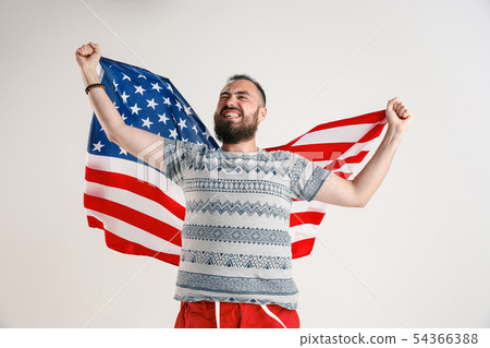 Young man with the flag of United States of America 54366388