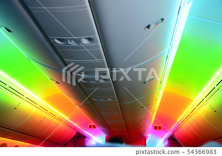Rainbow light in airplane cabin 54366983