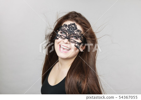 Mysterious woman wearing lace mask 54367055