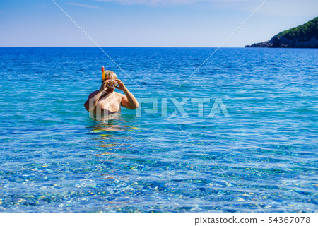 Man with snorkeling tube in sea Man with snorkeling tube in sea 54367078