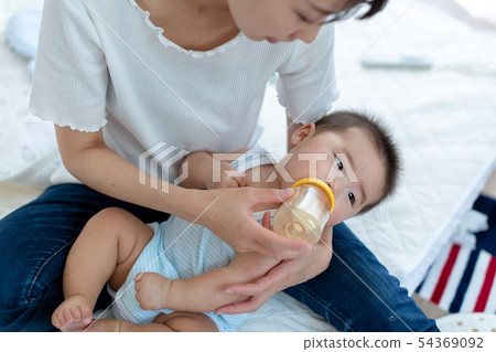 Breastfeeding Mom and 6 month baby Breastfeeding Mom and 6 month baby 54369092