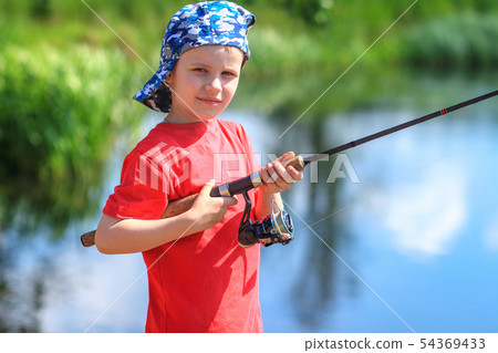 Fishing. Boy fisherman with fishing rod on lake. Fishing. Boy fisherman with fishing rod on lake. 54369433